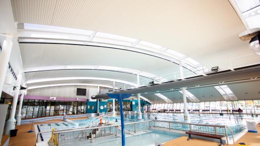 Aquatic centre with WAVELINE aluminium ceiling manufactured from PERMALITE aluminium in colour Glacier White